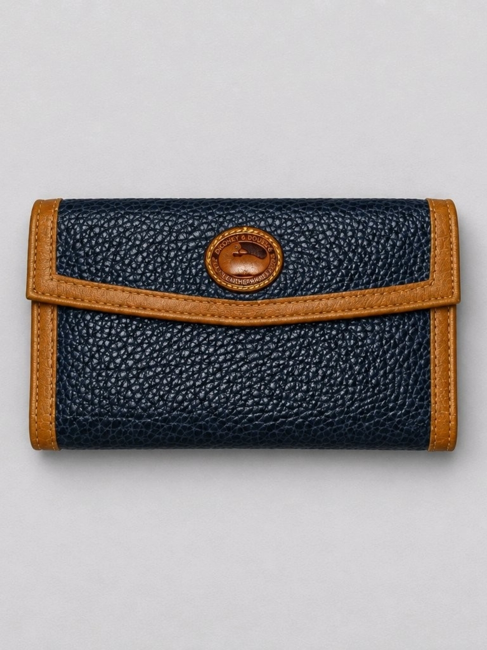 Dooney & Bourke Navy Pebble Leather Vintage Continental Wallet with Tan Trim